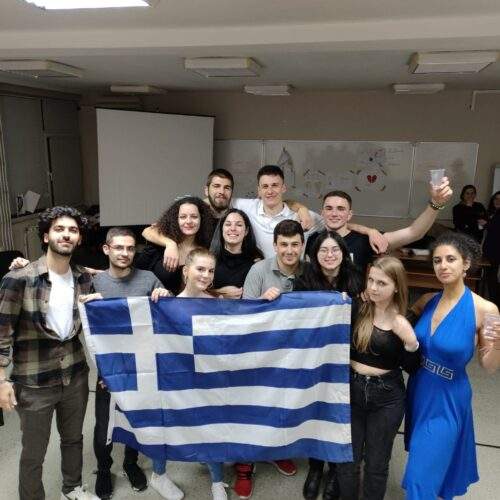 Demolife group holding Greek flag